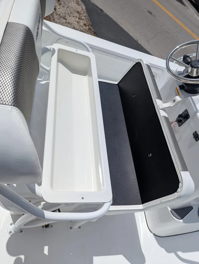 Slide: The Image of 2025 Frontier 2104 boat interior with seating and storage compartment. - 15