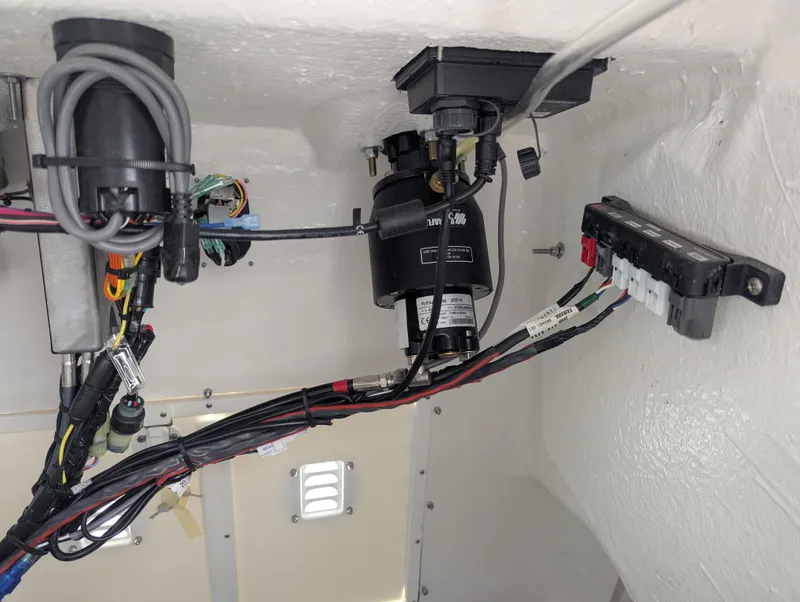 Slide: The Image of Interior wiring and components of a 2025 Frontier 2104 model boat. - 8