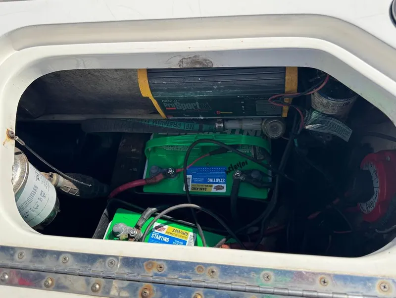 Slide: The Image of Battery compartment of a 2002 Boston Whaler 220 Dauntless boat. - 12