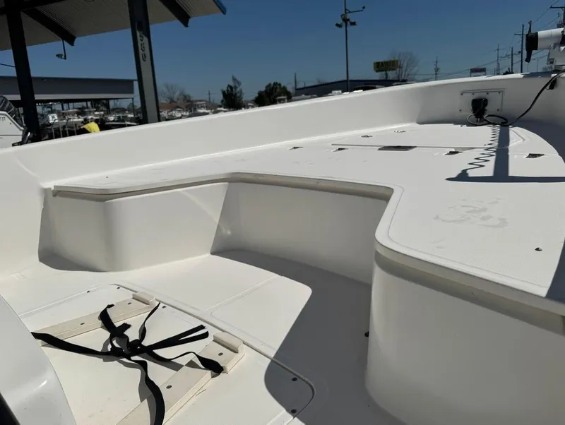 Slide: The Image of 2002 Boston Whaler 220 Dauntless boat interior with seating and storage compartments. - 19