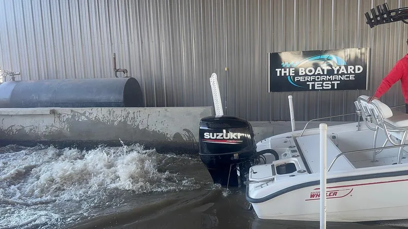 Slide: The Image of Boston Whaler 220 Dauntless 2002 undergoing performance test with Suzuki outboard engine. - 26