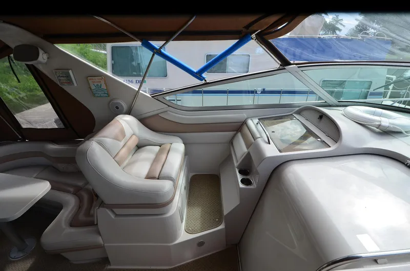 Slide: The Image of Interior of a 1994 Regal Commodore 400 boat with plush seating and modern dashboard. - 11