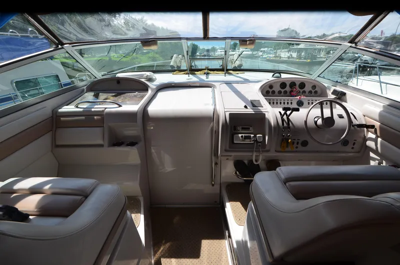 Slide: The Image of Interior of a 1994 Regal Commodore 400 boat cockpit with steering wheel and controls. - 30