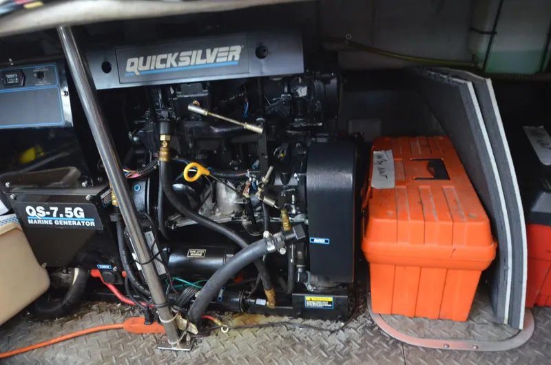 Slide: The Image of Engine compartment of a 1994 Regal Commodore 400 with Quicksilver marine generator. - 35