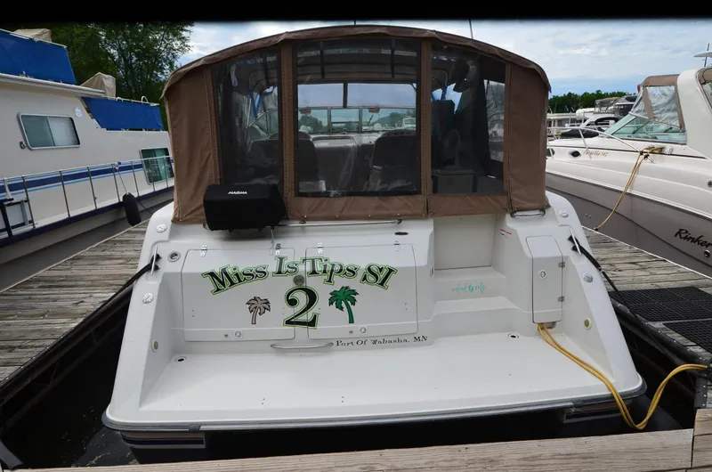 Slide: The Image of 1994 Regal Commodore 400 boat docked, featuring "Miss Is Tips SI 2" on the stern. - 5