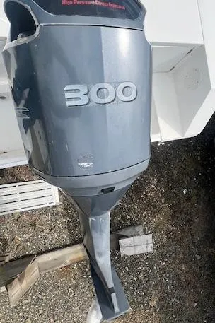 Slide: The Image of Outboard motor on a 2004 Regulator 24 Forward Seating boat, labeled "300." - 17