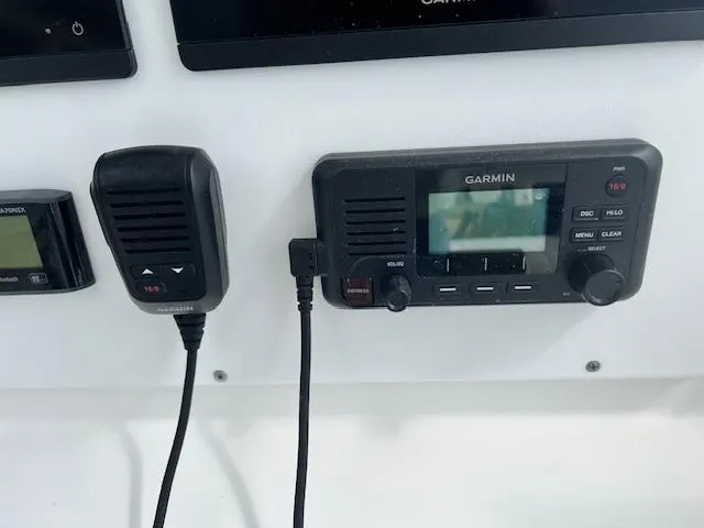 Slide: The Image of Garmin marine radio and microphone on 2004 Regulator 24 Forward Seating boat. - 5