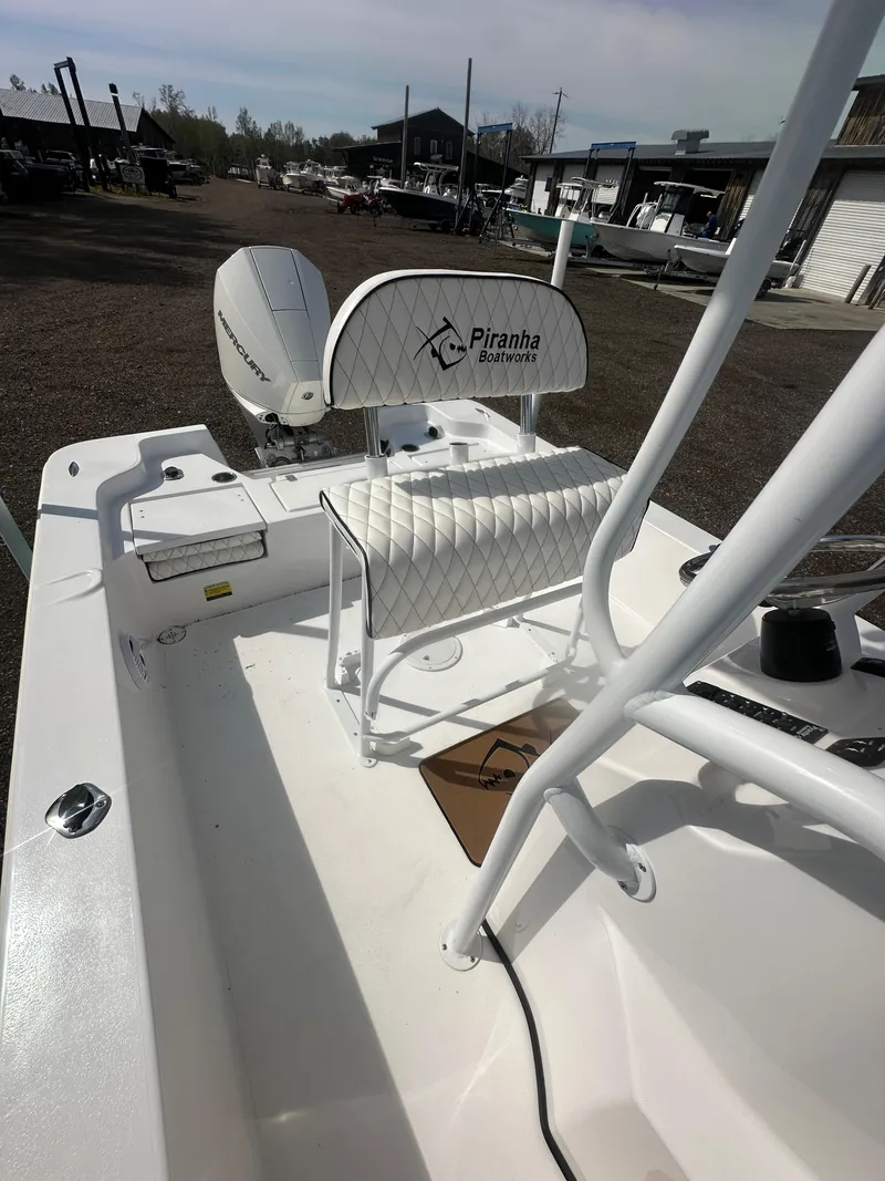 Slide: The Image of Control panel of 2025 Piranha Casador B2200 boat, featuring switches and controls. - 18