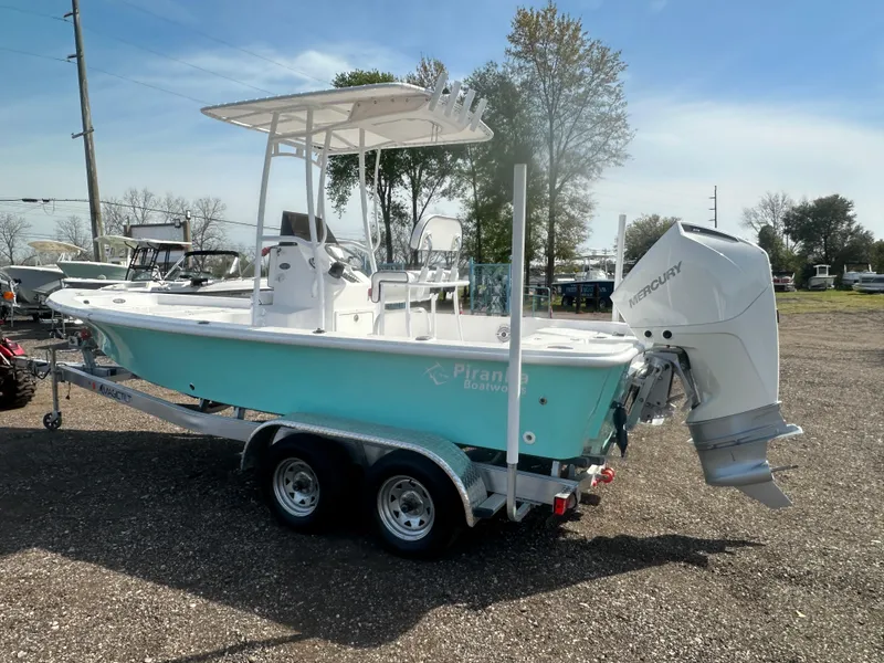 Slide: The Image of 2025 Piranha Casador B2200 boat on trailer, parked outdoors under clear sky. - 5