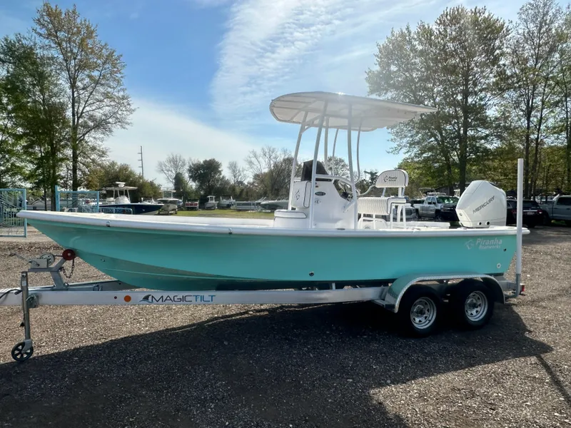 Slide: The Image of 2025 Piranha Casador B2200 boat on trailer, light blue hull, sunny day. - 6