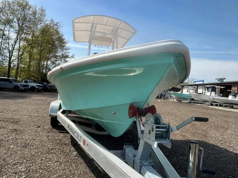 Slide: The Image of 2025 Piranha Casador B2200 boat with center console and seating, parked outdoors. - 8