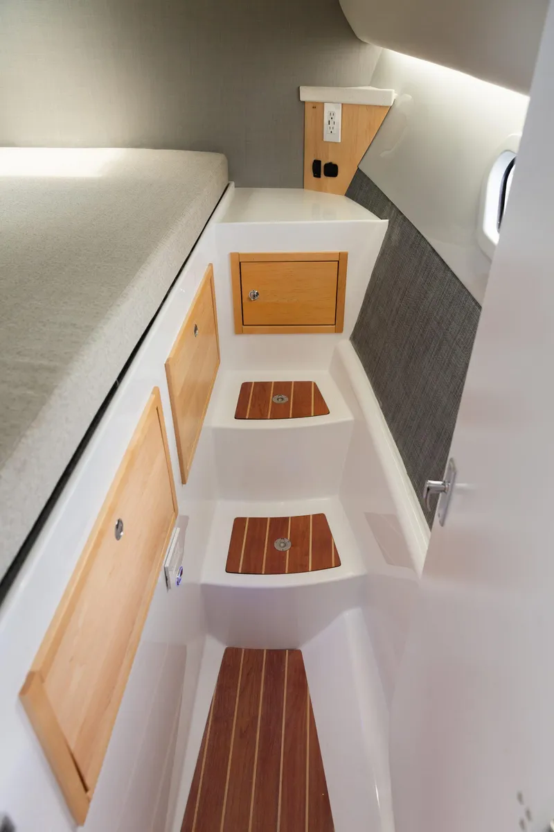 Slide: The Image of Interior of 2020 ArrowCat 320 Fly Dual Helm with wooden cabinets and steps. - 13
