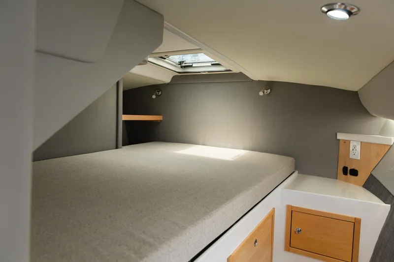 Slide: The Image of Interior cabin of 2020 ArrowCat 320 Fly Dual Helm with bed and storage. - 14