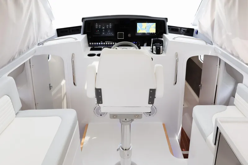 Slide: The Image of Interior of 2020 ArrowCat 320 Fly Dual Helm with modern navigation equipment. - 7