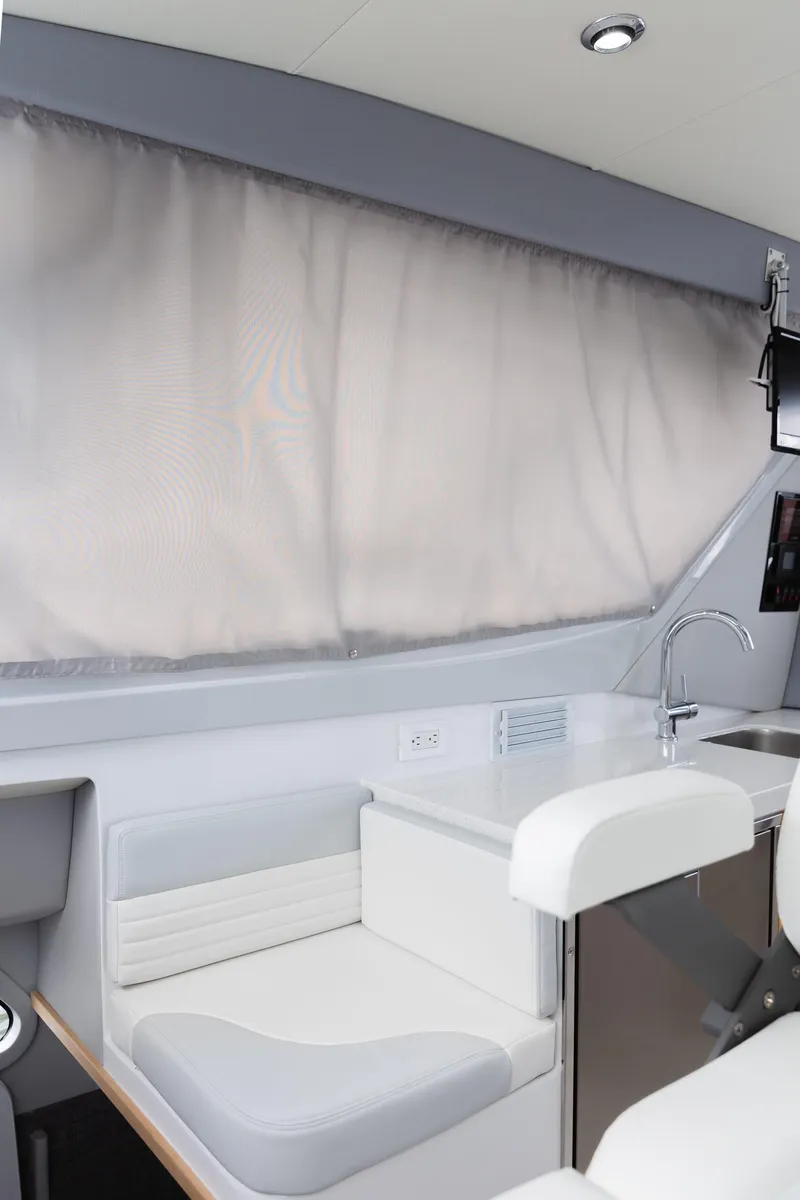 Slide: The Image of Interior of 2020 ArrowCat 320 Fly Dual Helm with modern seating and sleek design. - 9