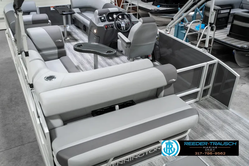 Slide: The Image of 2025 Bennington 21 SLJ pontoon boat interior with gray seating and modern dashboard. - 15