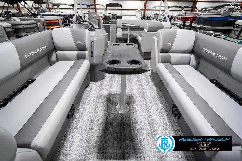 Slide: The Image of 2025 Bennington 21 SLJ pontoon boat interior with gray seating and central table. - 16
