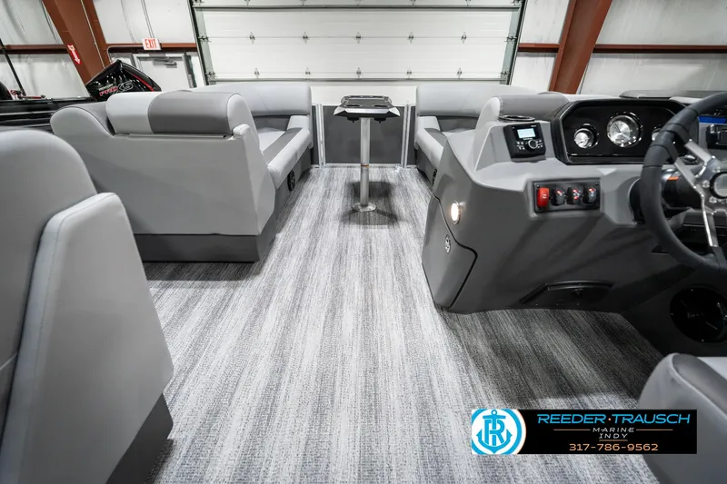 Slide: The Image of 2025 Bennington 21 SLJ boat interior with modern seating and control panel. - 20