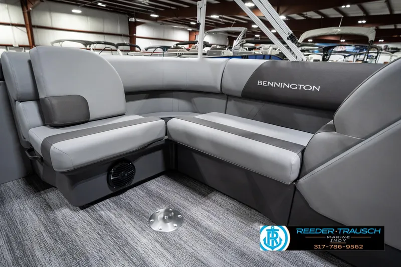 Slide: The Image of Interior of 2025 Bennington 21 SLJ pontoon boat with gray seating and logo. - 29