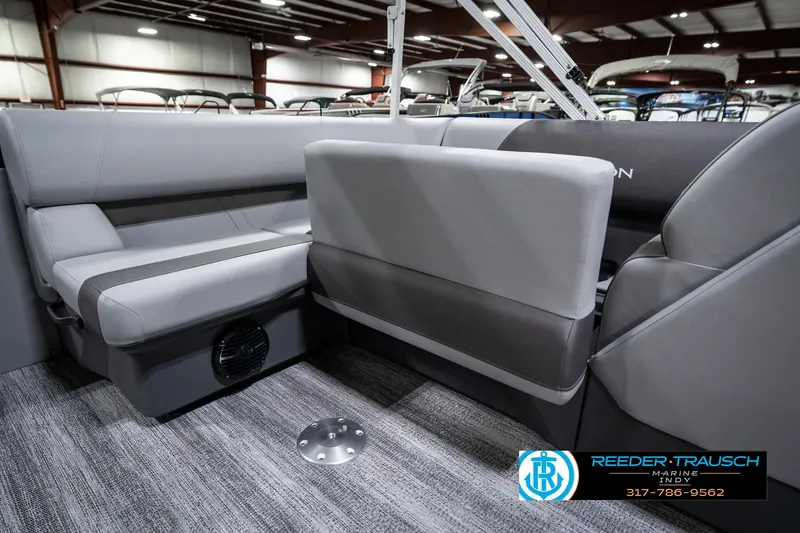 Slide: The Image of 2025 Bennington 21 SLJ boat interior with gray seating and carpeted flooring. - 30