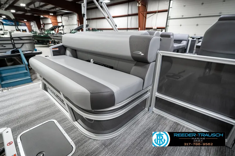 Slide: The Image of 2025 Bennington 21 SLJ pontoon boat interior with gray seating in showroom. - 31