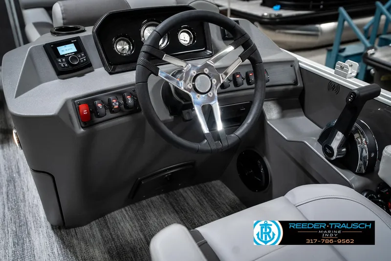 Slide: The Image of 2025 Bennington 21 SLJ boat dashboard with steering wheel and control panel. - 35