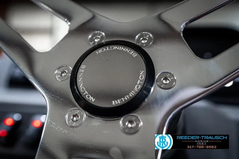 Slide: The Image of Steering wheel of 2025 Bennington 21 SLJ boat, featuring sleek metallic design. - 36