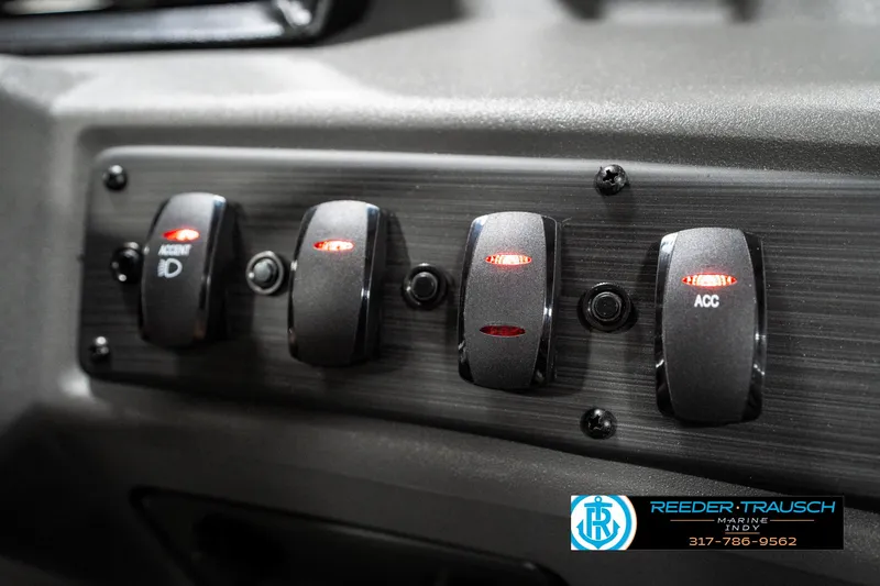 Slide: The Image of Dashboard switches of 2025 Bennington 21 SLJ boat, featuring illuminated controls. - 41