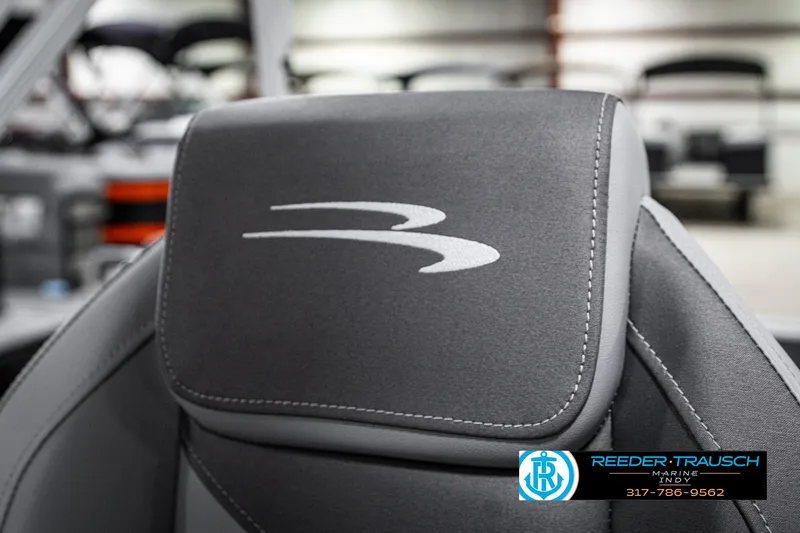 Slide: The Image of 2025 Bennington 21 SLJ boat seat with logo, featuring sleek gray upholstery. - 44