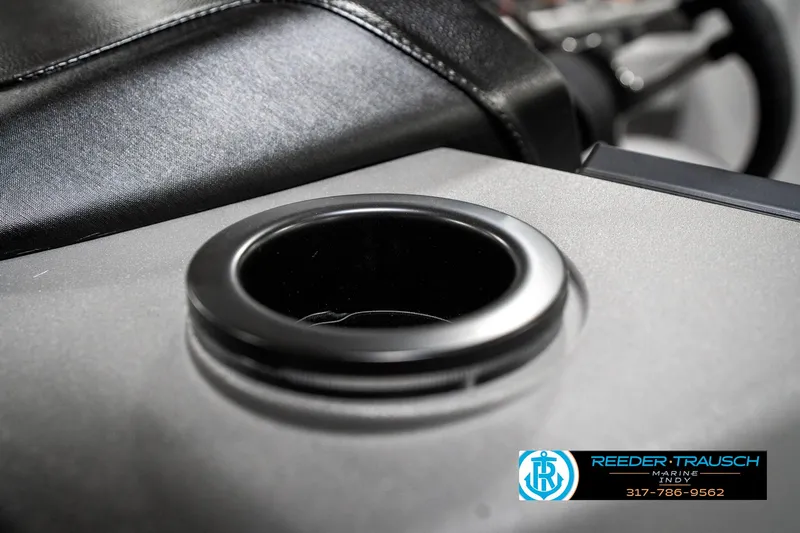 Slide: The Image of Cup holder in 2025 Bennington 21 SLJ boat interior, featuring sleek black leather seating. - 47