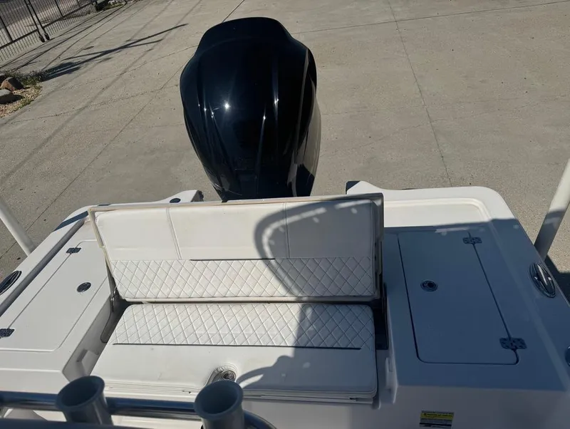Slide: The Image of 2021 Sportsman Tournament 234 SBX Bay Boat with outboard motor and seating area. - 13