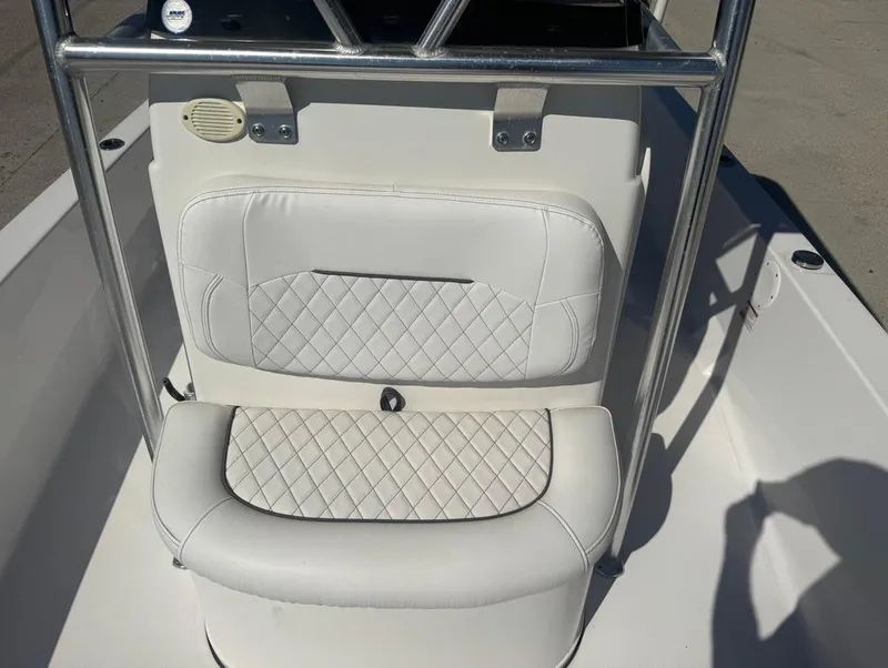Slide: The Image of 2021 Sportsman Tournament 234 SBX Bay Boat seat with diamond-patterned upholstery. - 14