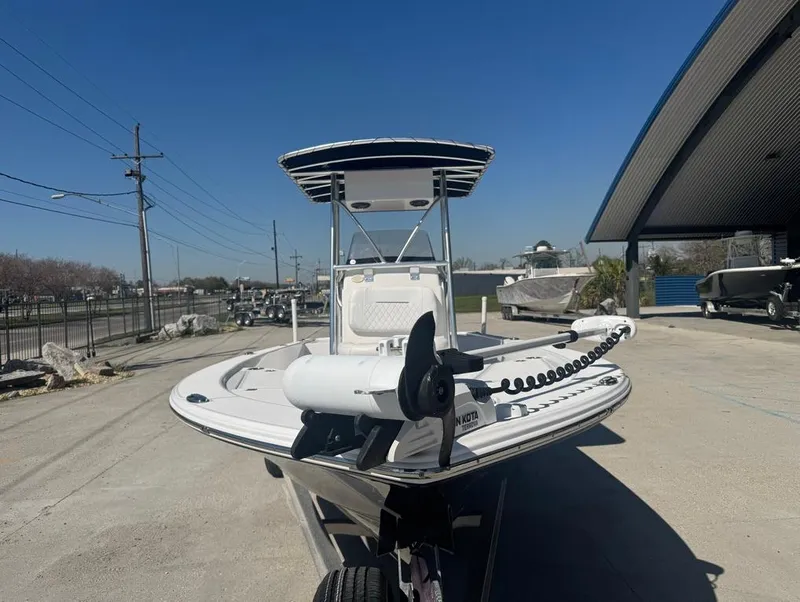 Slide: The Image of 2021 Sportsman Tournament 234 SBX Bay Boat displayed outdoors on a sunny day. - 4