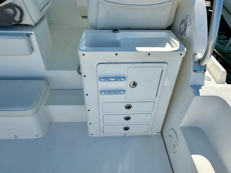 Slide: The Image of 2005 Stamas 320 Express boat interior with storage compartments and sink. - 27