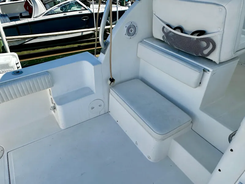 Slide: The Image of 2005 Stamas 320 Express boat interior with seating and storage compartments. - 28