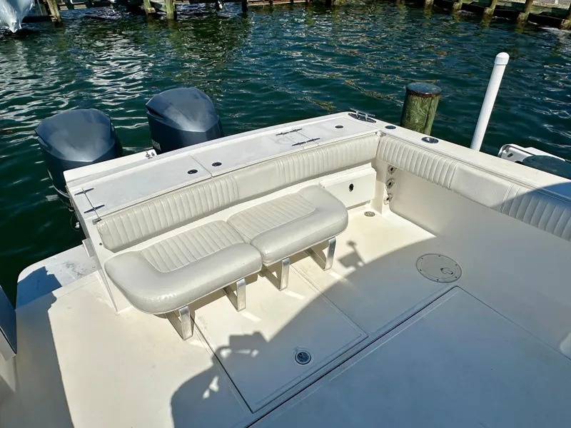Slide: The Image of 2005 Stamas 320 Express boat with spacious seating and dual outboard motors. - 29