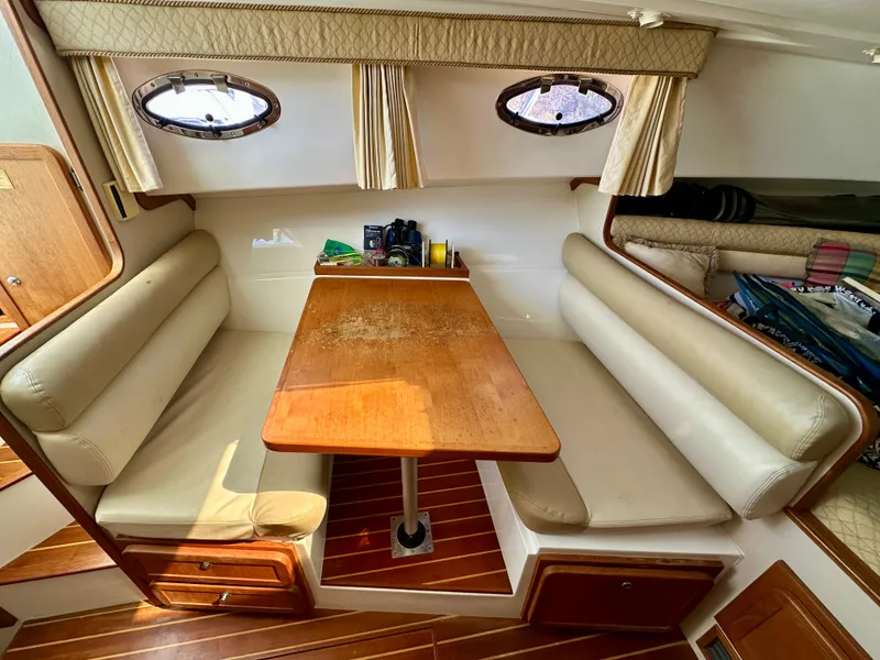 Slide: The Image of 2005 Stamas 320 Express cabin interior with dining area and wooden table. - 36