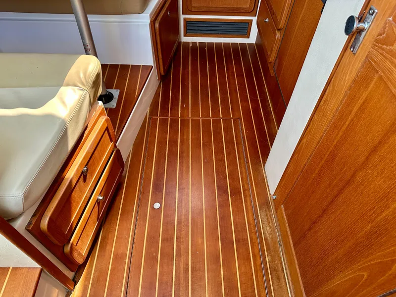 Slide: The Image of 2005 Stamas 320 Express interior with polished wood flooring and cabinetry. - 38