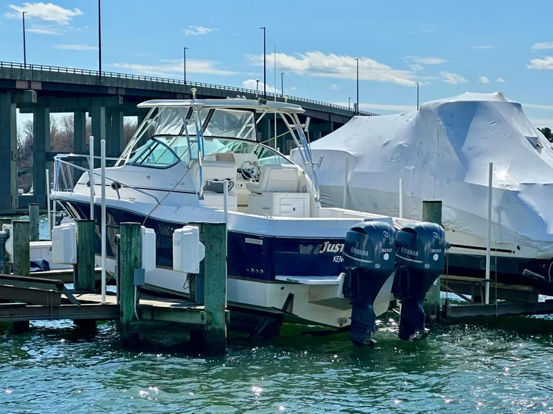 Slide: The Image of 2005 Stamas 320 Express boat docked with twin Yamaha engines. - 6