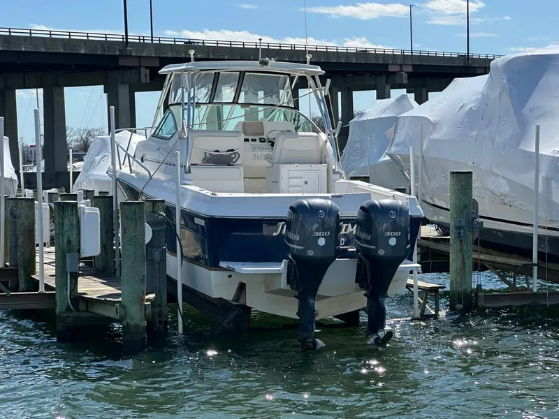 Slide: The Image of 2005 Stamas 320 Express boat docked with twin Yamaha engines. - 7