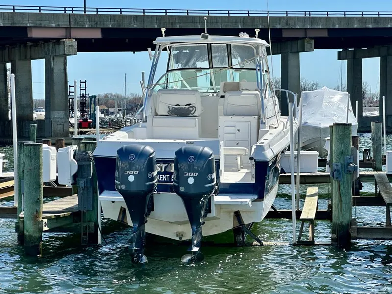 Slide: The Image of 2005 Stamas 320 Express boat docked with twin 300 horsepower engines. - 8