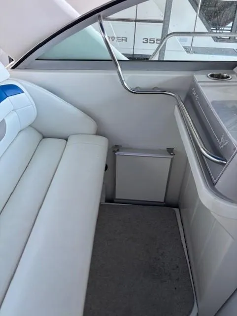 Slide: The Image of 1997 Formula 34PC boat interior with white seating and modern design. - 11