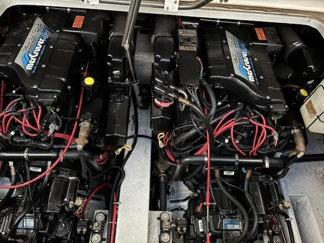Slide: The Image of 1997 Formula 34PC engine compartment with twin MerCruiser engines and red wiring. - 20