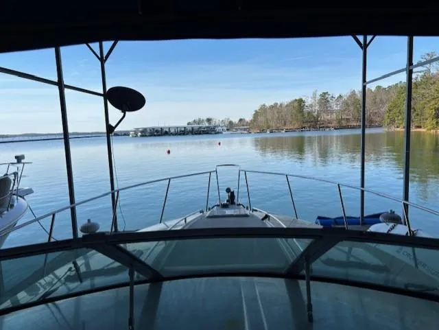 Slide: The Image of View from 1997 Formula 34PC boat overlooking serene lake and distant shoreline. - 22