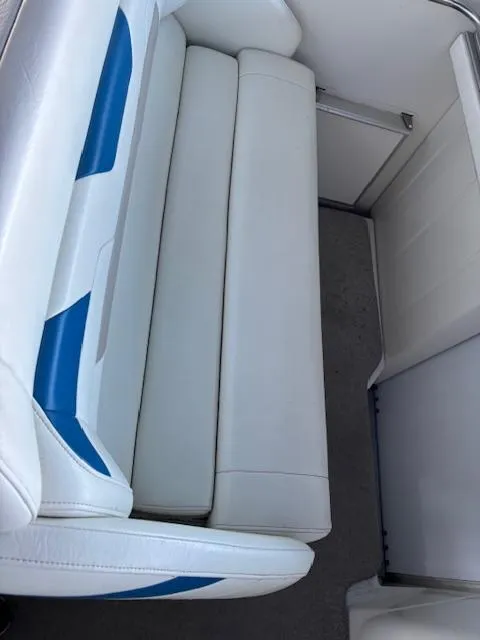 Slide: The Image of 1997 Formula 34PC boat interior with white and blue seating. - 8