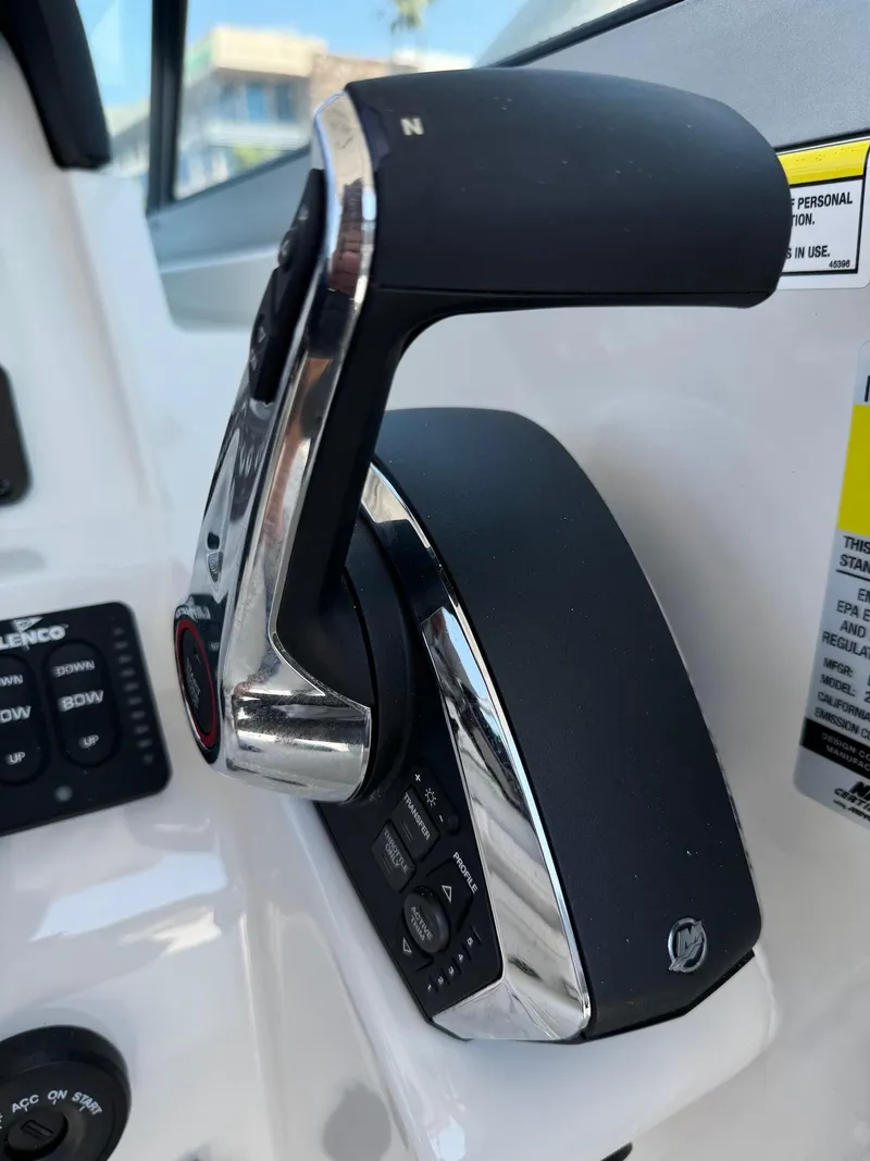 Slide: The Image of Close-up of 2024 Finseeker 245 WA boat throttle control lever. - 12