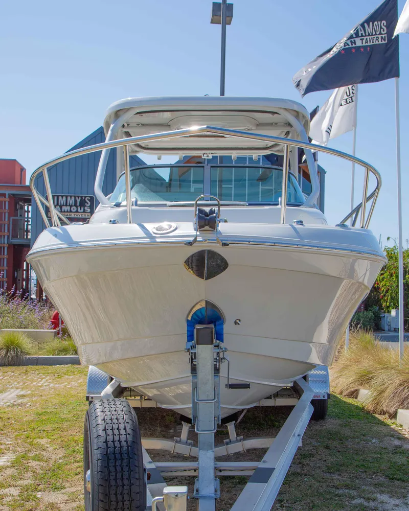 Slide: The Image of 2024 Finseeker 245 WA boat on trailer, front view, outdoor display. - 21