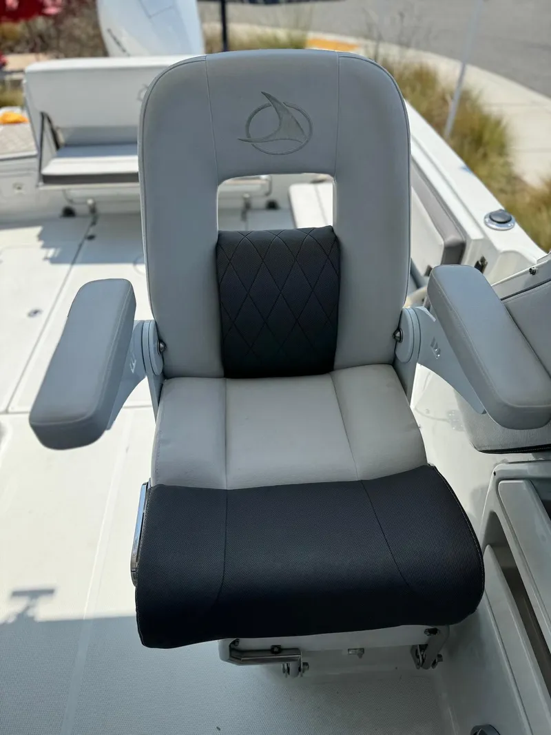 Slide: The Image of 2024 Finseeker 245 WA boat seat with armrests, featuring a modern design and comfortable padding. - 6