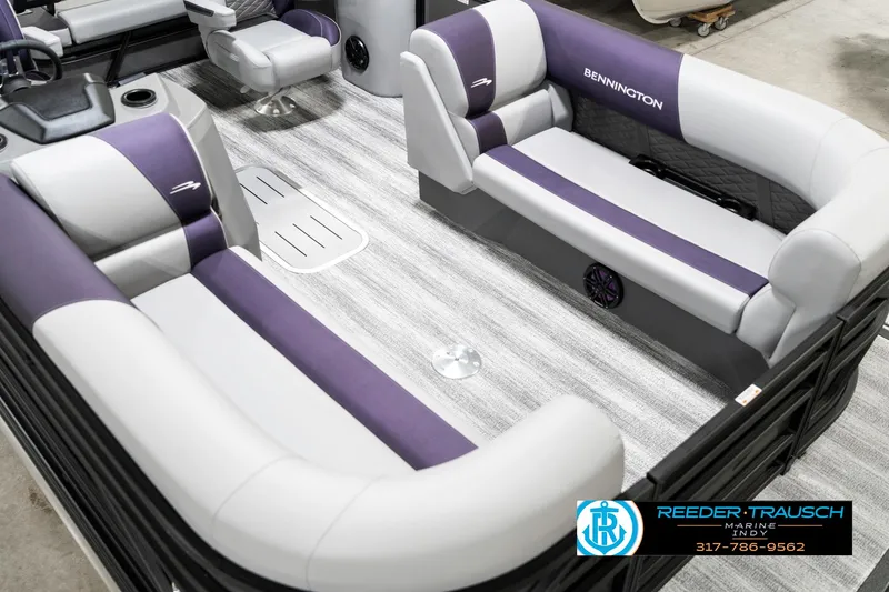 Slide: The Image of 2025 Bennington 21 SSB pontoon boat interior with gray and purple seating. - 13