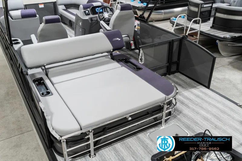 Slide: The Image of 2025 Bennington 21 SSB pontoon boat interior with seating and control panel. - 15